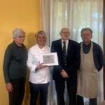 La consegna del Diploma ai proprietari Alberto Faccioli, Monica Bimbatti e alla mamma Giuliana